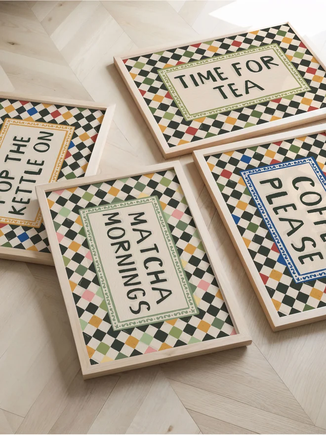 Matcha mornings checkerboard art prints on a wooden table. 