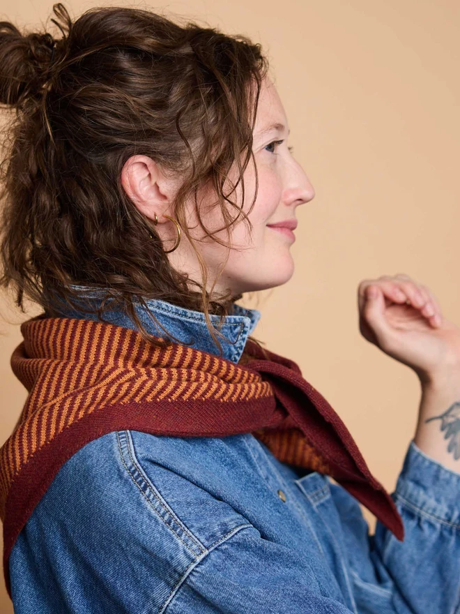woman wearing rust stripe wool neckerchief