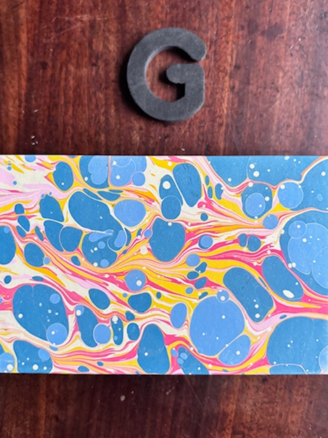 Matchbox Cover. A matchbox cover in G