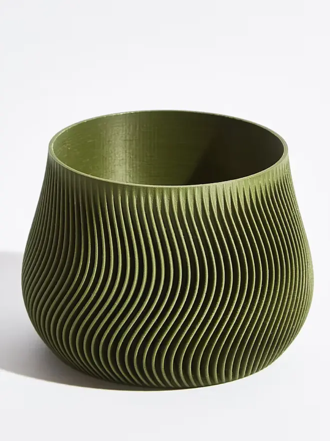 Sustainable 3D Printed Forest Green Plant Pot, groovy design against a white background. 