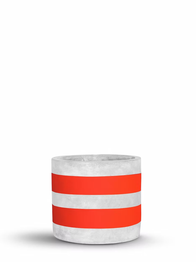 two stripes concrete plant pot. a grey plant pot with red painted stripes.