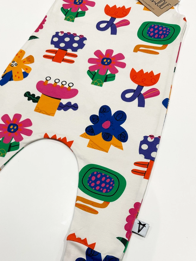 Baby romper in collage flower print fun baby romper colourful and bright