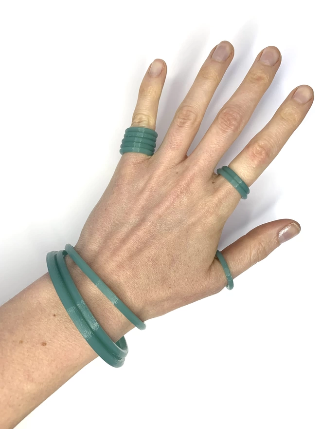 Get the full look by layering the band rings and bangles together