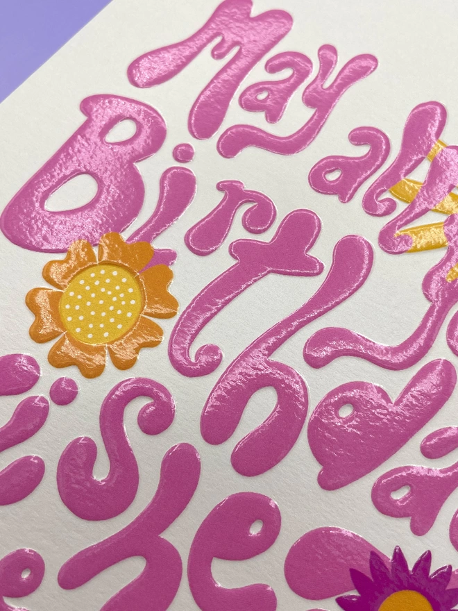 Detailed image of the spot UV and emboss finish that really enhances the Raspberry Blossom greetings card design  