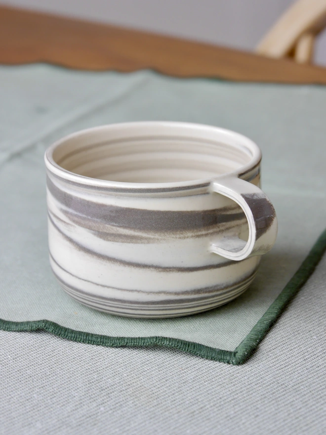 Small handmade grey and white marble mug