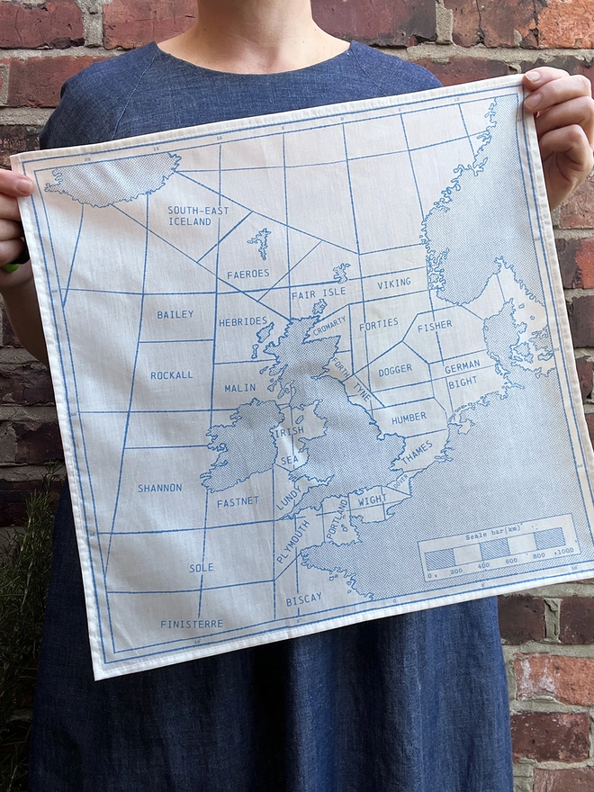 Holding up a Mr.PS sky blue Shipping Map Handkerchief 