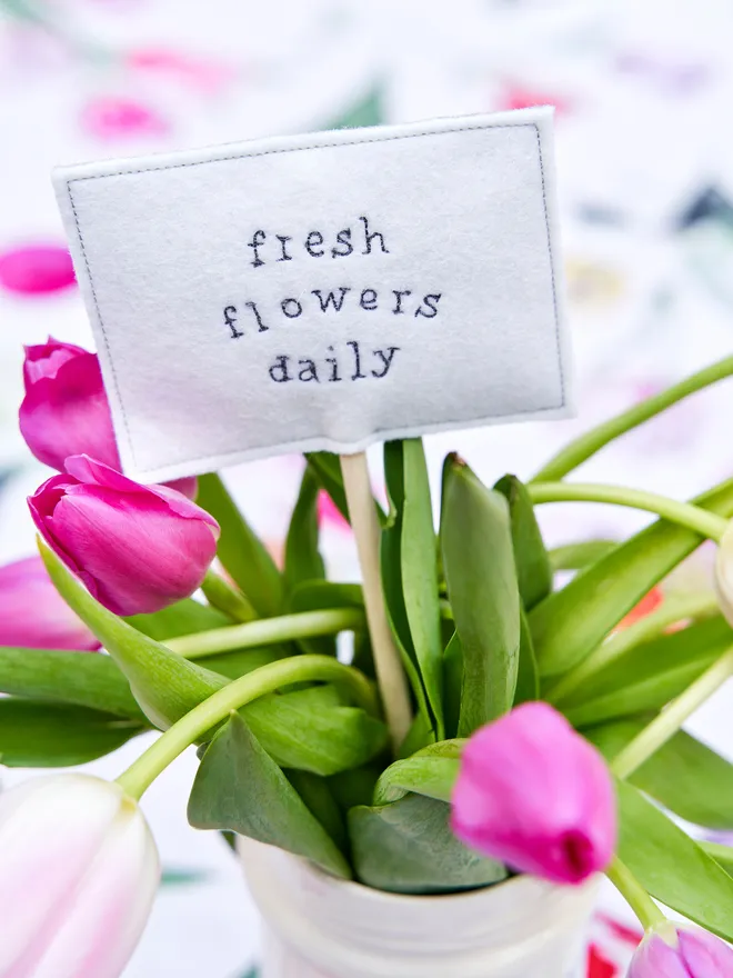 Fresh flowers served daily sign