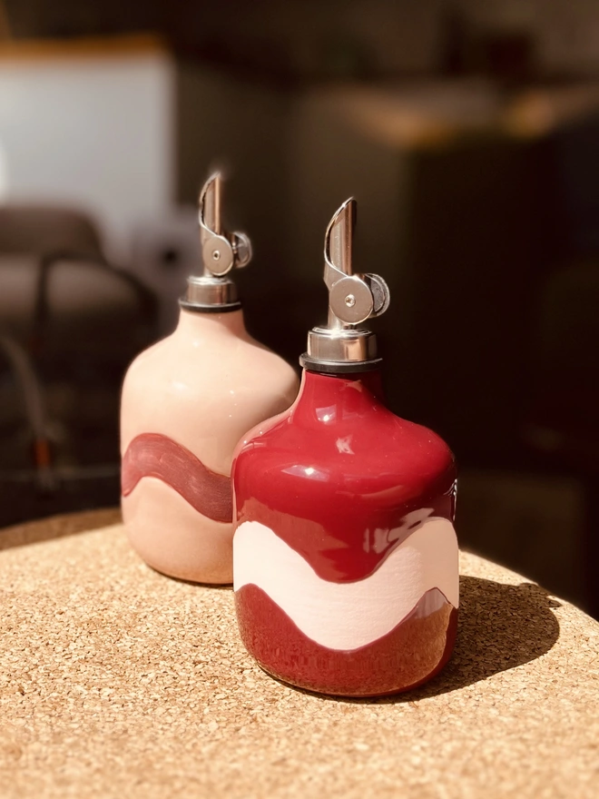 sangria burgundy and blush pink oil bottles