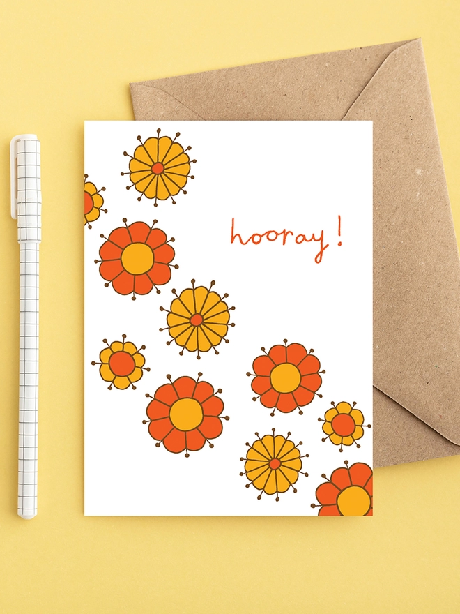 Colourful celebration card featuring hand drawn flowers
