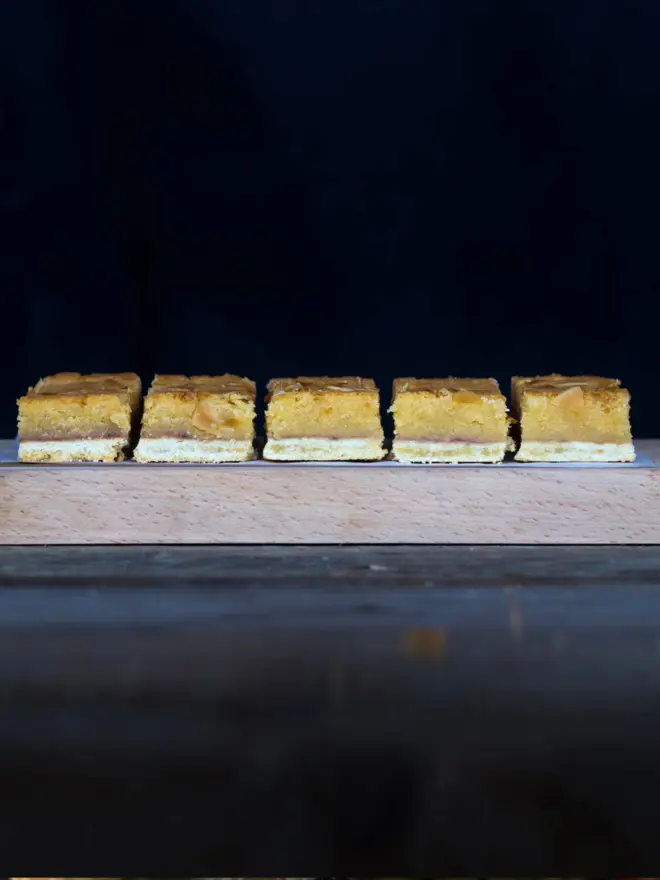 A tray of sliced bakewell tart