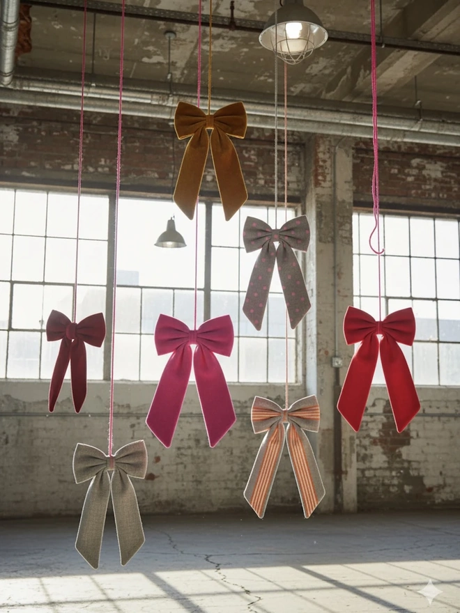 Over Sized Linen Polka Dot Bow Hanging Christmas Decoration, a group of polka dot bows hanging in a top floor studio. 