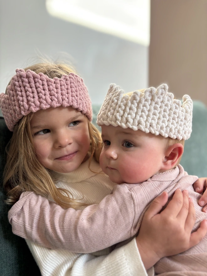kids with crochet christmas crowns on