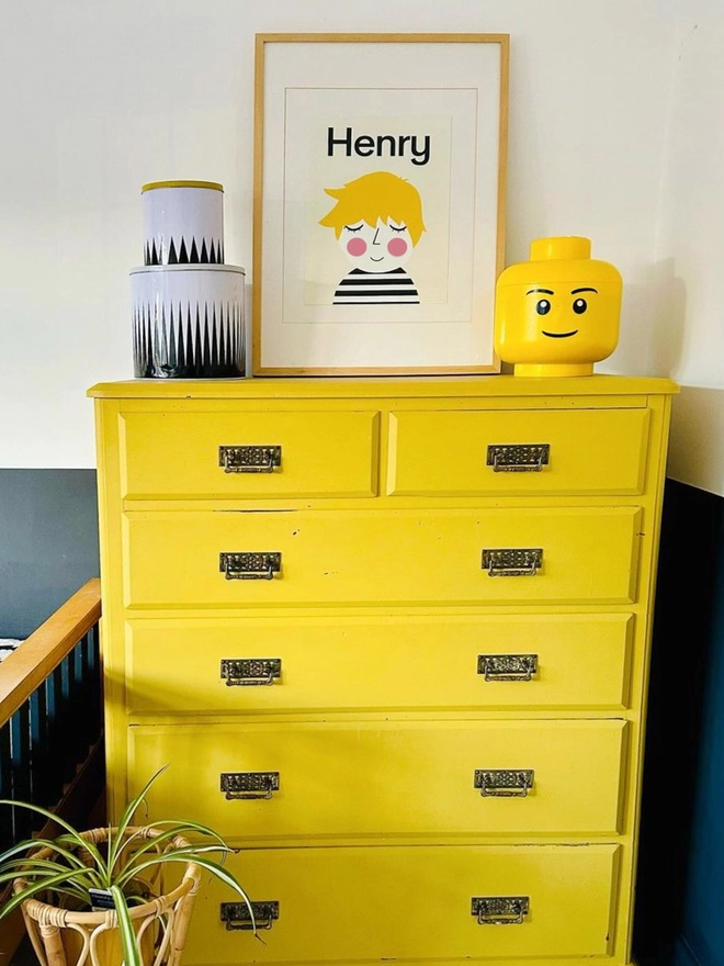 personalised portrait on a yellow chest of drawers