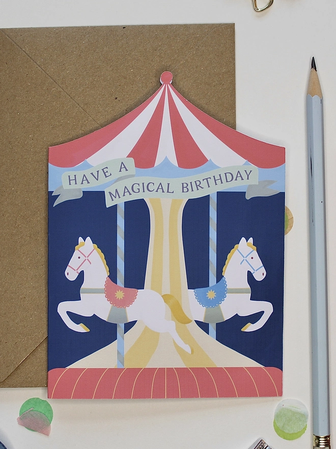 Carousel Circus Birthday card with two horses on a merry go round