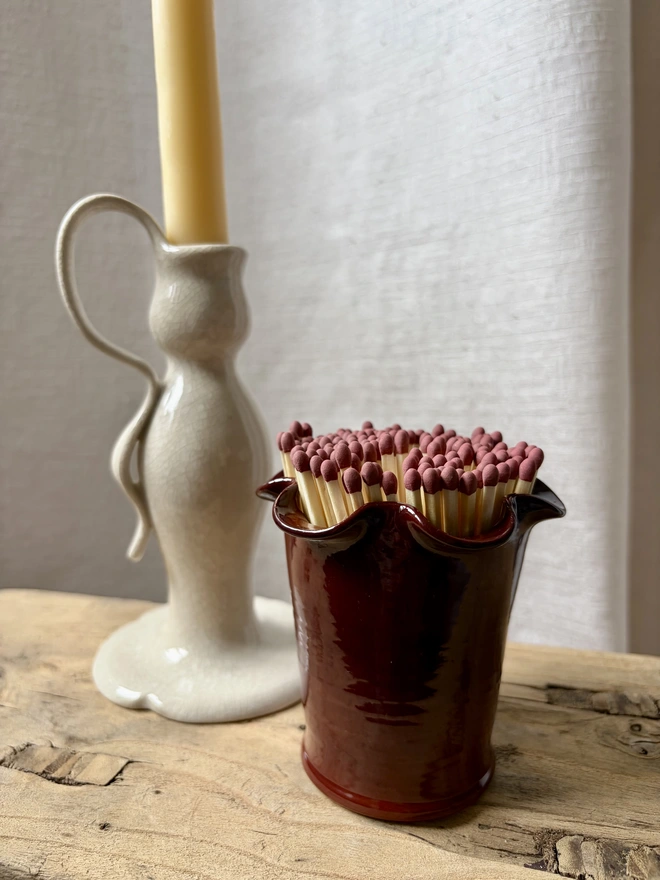 Cherry red frilly matchstick pot with matches