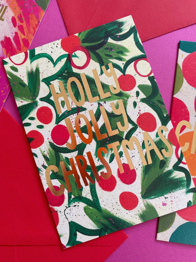 Colourful & Joyful Painterly Holly Pattern Design Christmas Card ‘Holly Jolly Christmas’ | Raspberry Blossom