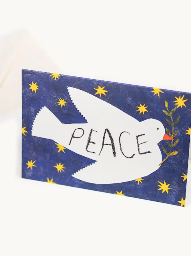 dove card with blue background and 'peace' text