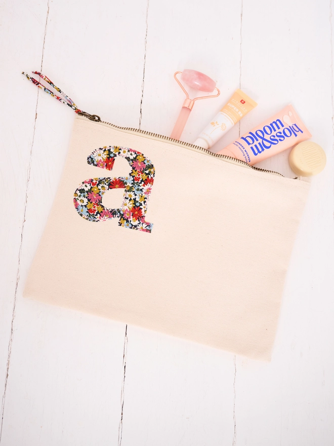 a natural make up zip up pouch personalised with a liberty print initial 