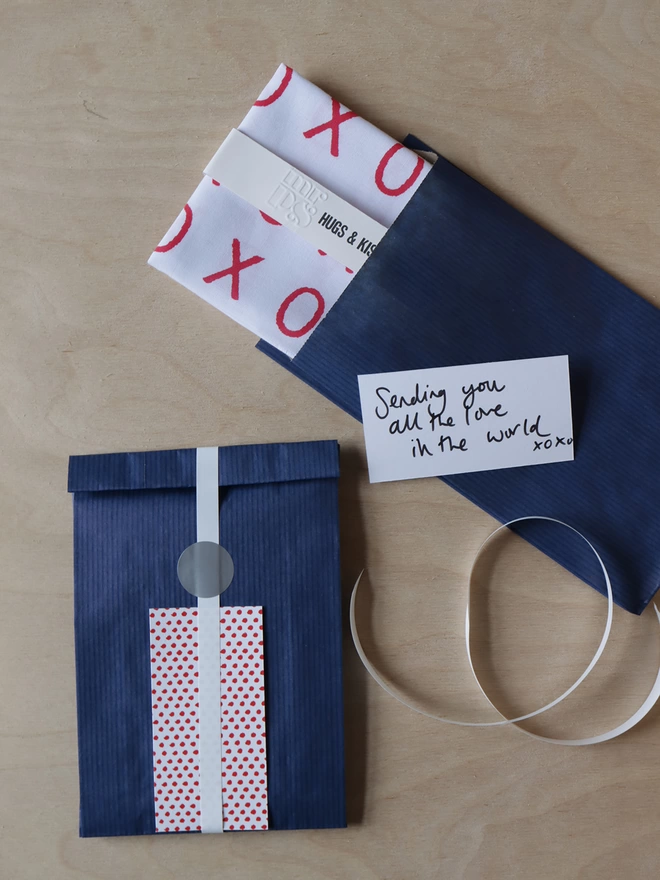 Optional gift wrap of navy paper, ribbon and dotty card