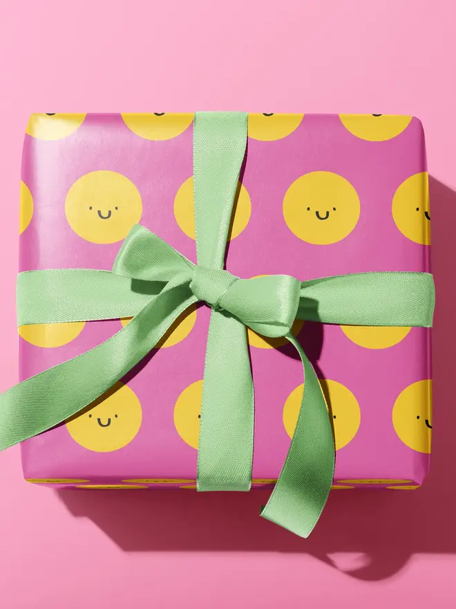 pink yellow smiley face wrapping paper