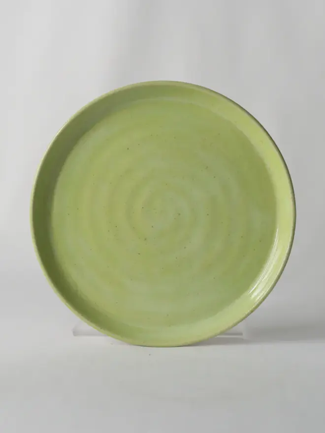 light green ceramic cake plate with textured swirl design