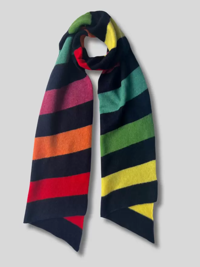 Navy scarf with colourful stripes laid flat