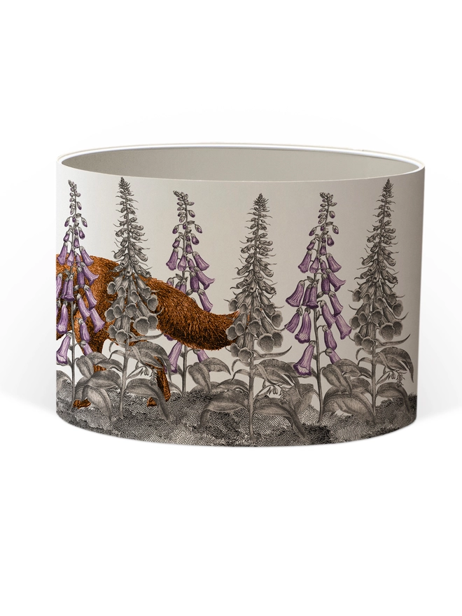 Handmade lampshade featuring a mischievous fox moving through foxglove flowers in a whimsical woodland design.