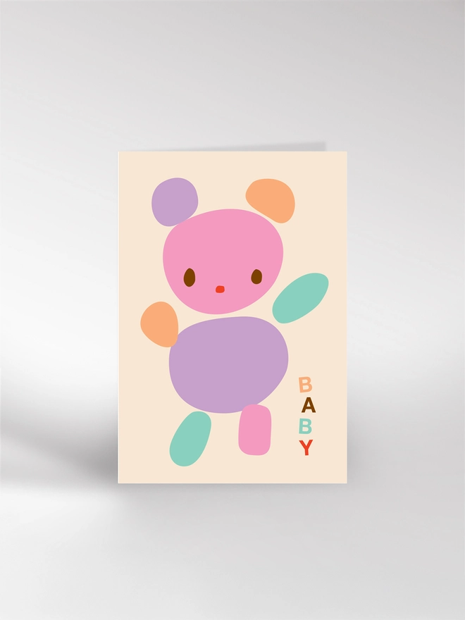 New baby card featuring a illustrated teddy bear in different colours