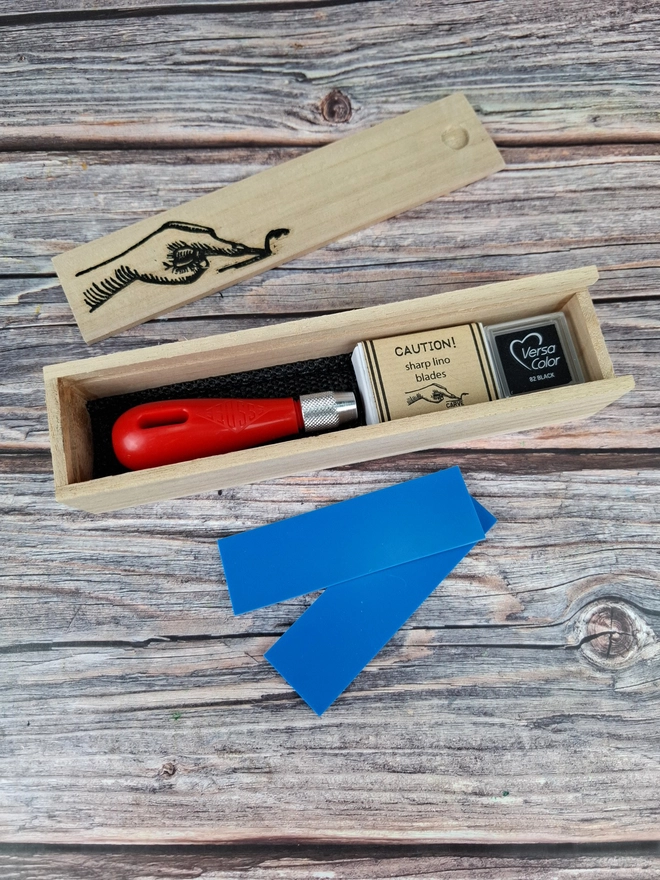Lino carving and printing kit in wooden box with blue soft lino and versicolor ink pad