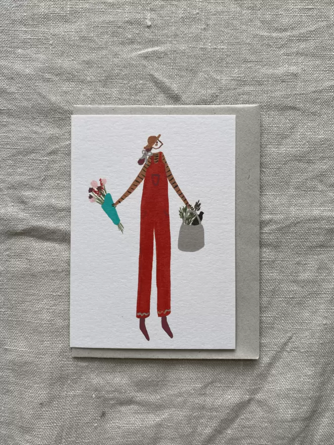 greetings card with girl in orange dungarees on 
