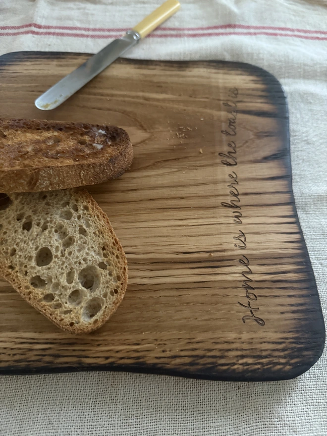 Engraved toast shaped serving board with real toas