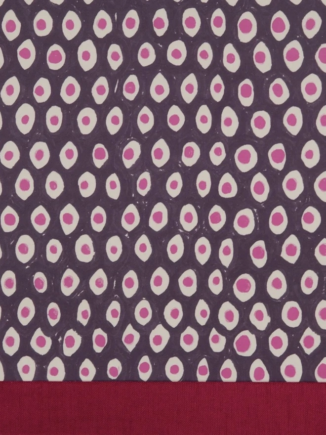 Retro Drum Lampshade. Close-up of a hand block printed lampshade showing a bold repeating geometric pattern. The colourful printed design and neat trim bring character and a handcrafted finish to any lamp.