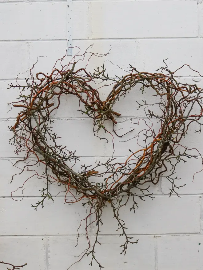 heart shaped wreath made from magnolia branches