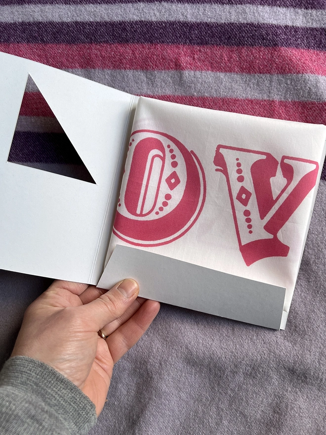 Opening up the wallet that packages a Mr.PS Love Love Love Handkerchief