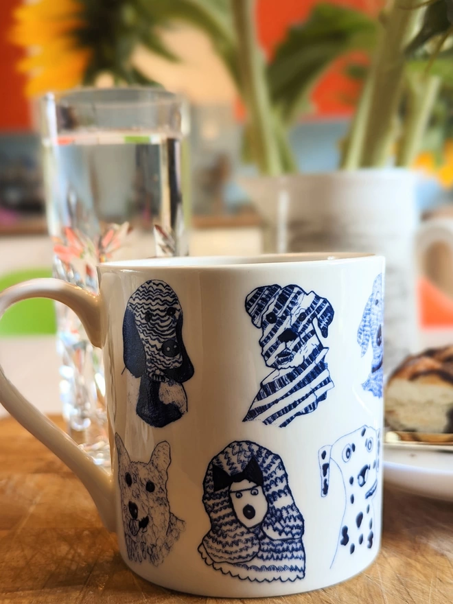 close up photo of blue dogs charity fine bone china dog gift mug featuring blue dog illustrations