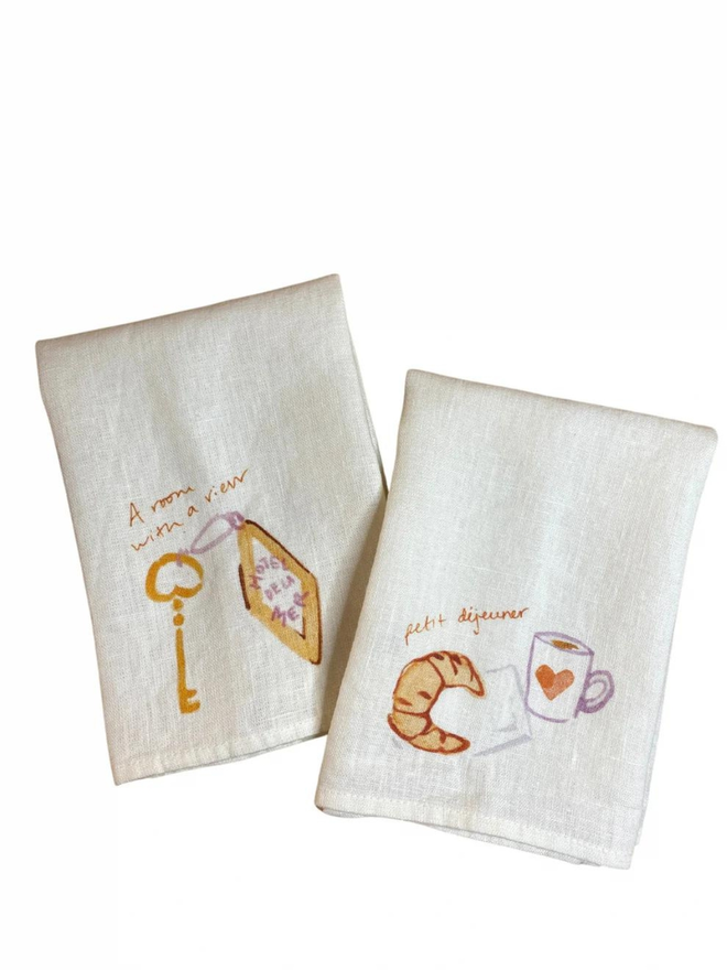 hotel room key and coffee and croissant print linen napkin set of two