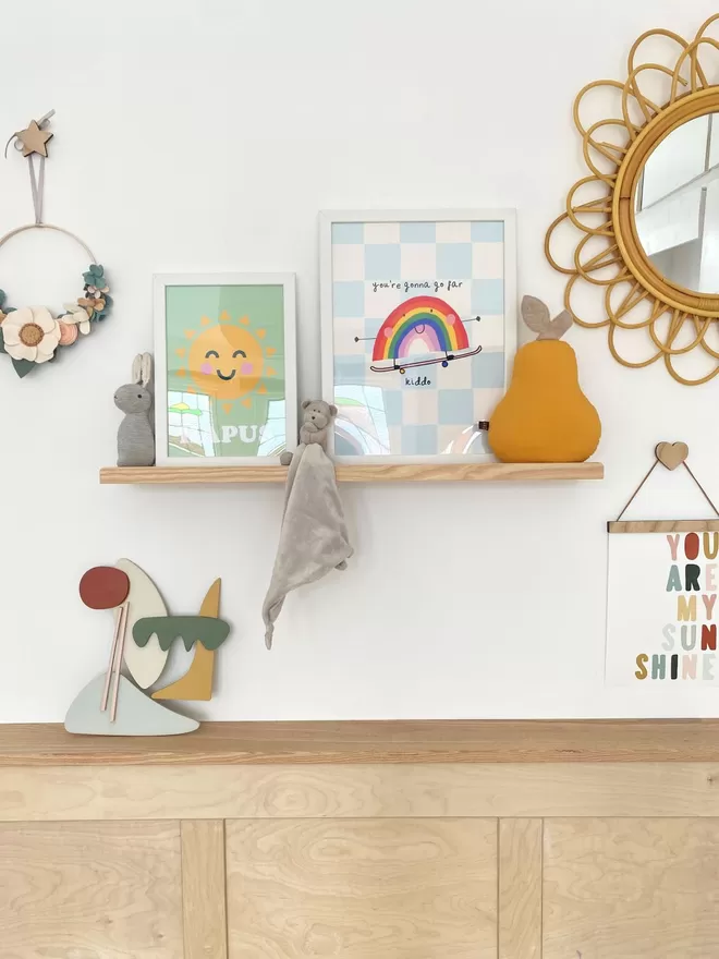 Autumn's Corner solid wood picture ledge, styled up with kids prints and teddies