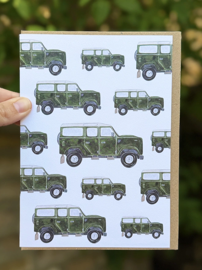Land Rover Defender card hand painted in watercolour against garden backdrop.
