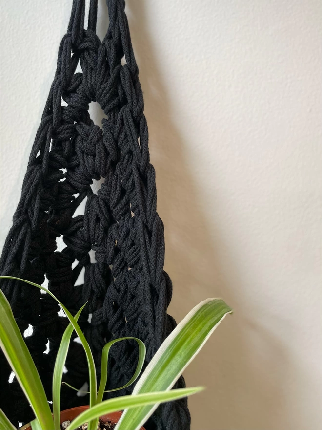 indoor medium black recycled cotton hanging wall planter, fabric wall mounted plant holder, handmade crochet plant basket, handmade sustainable crochet decor, rustic natural organic homeware accessories, black hanging plant holder with hook to hang