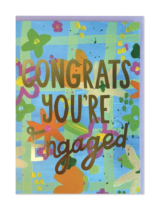A painterly engagement card with abstract design in vibrant brush strokes. Finished with a gold foil ‘Congrats you’re engaged’ message 