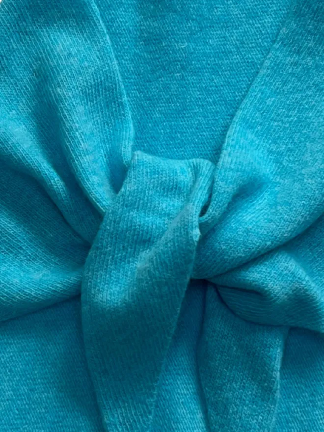 Detail of turquoise triangle scarf 