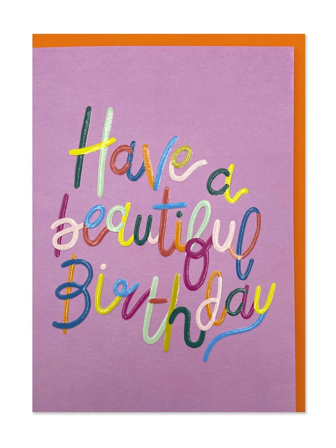 A colourful and bold Birthday card with ‘Have a beautiful Birthday’ message in playful vibrant type on a pink background 