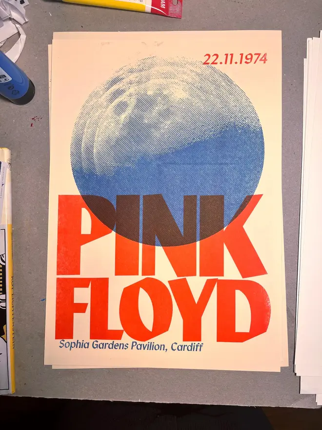 'Pink Floyd' Handmade Risograph Gig Poster, hanging on a grey wall. 
