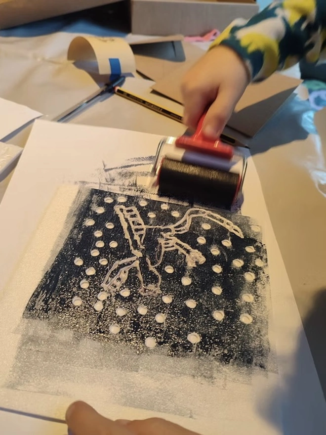 Poly Block Printing Craft Kit, child rolling on paper