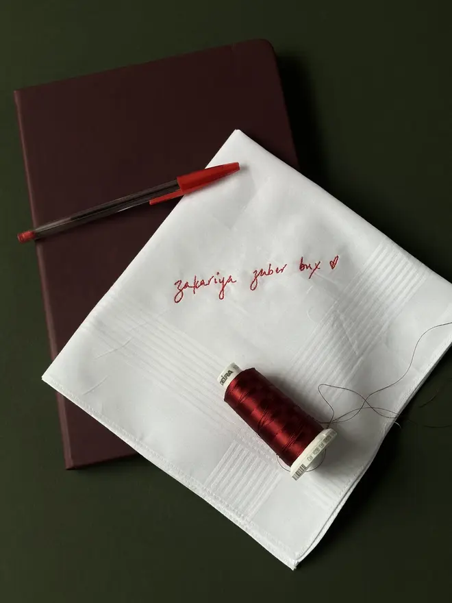 white handkerchief with red text