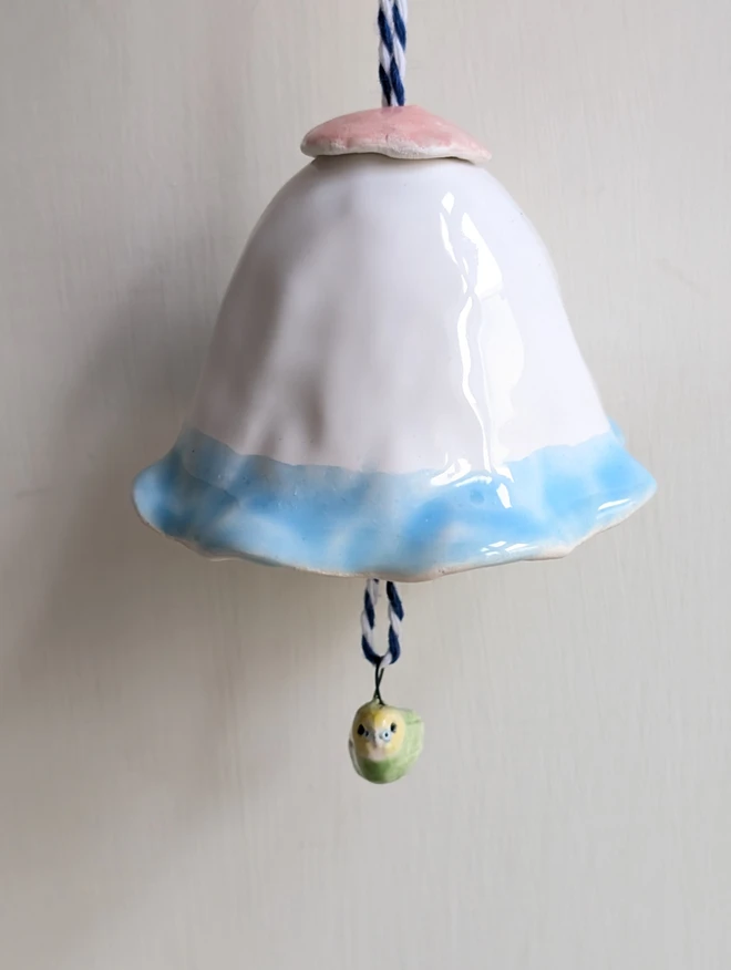 pottery budgie hanging bell decoration with a miniature green ceramic bird