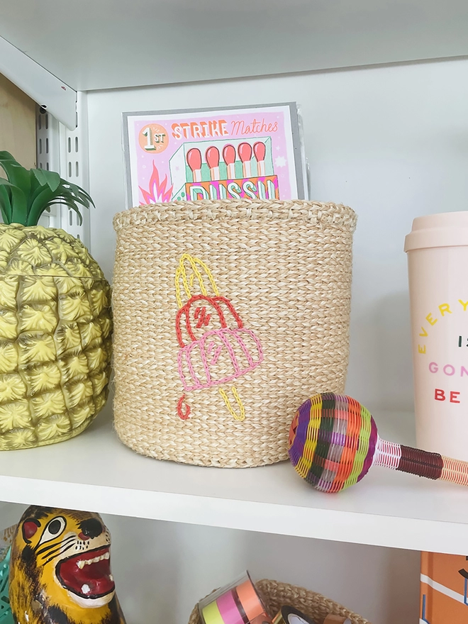 lolly motif basket displayed on a shelf