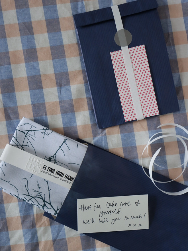 Optional gift wrap of navy paper, ribbon and a handwritten card