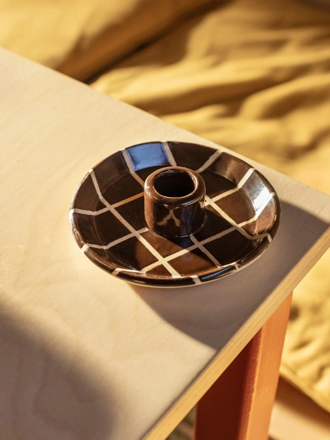 Ceramic Patterned Candlestick Holder, a colourful candlestick holder sitting on a table top surface. 