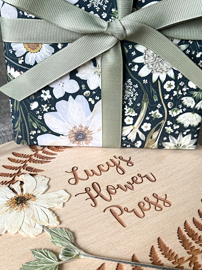 Luxury gift wrap paper sheets created from pressed white flowers, including Nigella, Daisy, Astrantia, Queen Anne's Lace, Hydrangea, Cow Parsley and Heather.